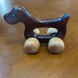 Dog shaped rolling massager